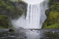 Beautiful Skogafoss waterfall. The most popular destination in Iceland. Water falling down a beautiful valley building Royalty Free Stock Photo