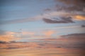 Beautiful sky background. Light blue sky with dramatic orange, pink and gray clouds.