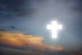 Beautiful sky .Beaming bright white cross in heaven . Glowing light cross