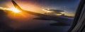 Beautiful sky and clouds, View from a commercial airplane window, Flight and holiday travel, Wing aircraft at sunset, space for Royalty Free Stock Photo