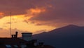 Beautiful sky and colourful clouds at sunset time over the mountains and town. Pure photo. No postprocessing no Photoshop Royalty Free Stock Photo