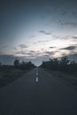 Beautiful sky with endless old road, with trees on the side Royalty Free Stock Photo