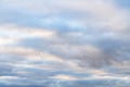 Beautiful sky on an overcast day with blue and purple shades on cumulus heaven clouds.