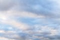 Beautiful sky on an overcast day with blue and purple shades on cumulus heaven clouds.