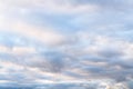 Beautiful sky on an overcast day with blue and purple shades on cumulus heaven clouds.