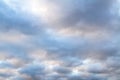 Beautiful sky on an overcast day with blue and purple shades on cumulus heaven clouds.