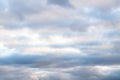 Beautiful sky on an overcast day with blue and purple shades on cumulus heaven clouds.