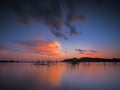 The beautiful of the sky and reflections on the surface of the lake after sunset Royalty Free Stock Photo