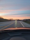 Beautiful skyline pink peach purples road dusk headlight