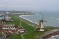 Beautiful skyline of the windmill of vlissingen with some houses and view at sea, typical dutch landscape, popular city in zeeland Royalty Free Stock Photo