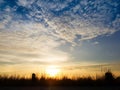 Beautiful skyscape clear blue sky and golden cloud background during sunset. Clearing day and Good weather in the evening Royalty Free Stock Photo