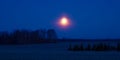 A beautiful skyscape with a moon in the dark skies. Springtime scenery before the dawn with moon.