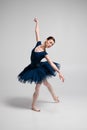 Beautiful ballerina posing in studio