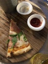 A beautiful slice and delicious pizza on the wooden plate. Royalty Free Stock Photo