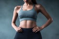 Beautiful Slim Body Woman in Sportwear Showing Her Slim Waist extreme closeup. Generative AI Royalty Free Stock Photo