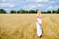 Beautiful slim sexi blond lady in white long dress Royalty Free Stock Photo