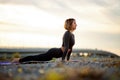 Beautiful slim sporty woman in yoga pose outdoors in city Royalty Free Stock Photo