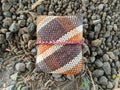 beautiful small bags made from leaves woven between pebbles and grass