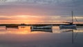 Beautiful small boats during peaceful sunset over the water