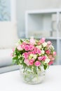 Beautiful small bouquet with roses in glass vase Royalty Free Stock Photo