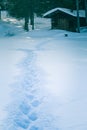 A beautiful small cabin on a shore of lake in central Norway. Snowy winter landscape. Royalty Free Stock Photo