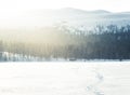 A beautiful small cabin on a shore of lake in central Norway. Snowy winter landscape. Royalty Free Stock Photo