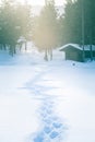 A beautiful small cabin on a shore of lake in central Norway. Snowy winter landscape. Royalty Free Stock Photo