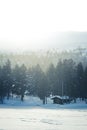 A beautiful small cabin on a shore of lake in central Norway. Snowy winter landscape. Royalty Free Stock Photo