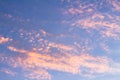 Beautiful small clouds during the sun fall. The golden hour paints the clouds of warm colors Royalty Free Stock Photo