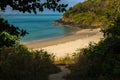 A beautiful small cove beach on the island of Koh Lanta, Thailand with the sparkling waters of the Andanman Sea