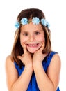 Beautiful small girl with blue dress and a flowersÃÂ´ wreath on h Royalty Free Stock Photo
