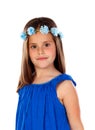 Beautiful small girl with blue dress and a flowersÃÂ´ wreath on h Royalty Free Stock Photo