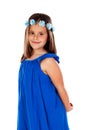 Beautiful small girl with blue dress and a flowersÃÂ´ wreath on h Royalty Free Stock Photo