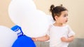 Happy little girl with blue and white balloons and Israel flag. Royalty Free Stock Photo