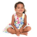 Beautiful small hispanic girl sitting on the floor Royalty Free Stock Photo