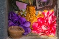 Beautiful small Indian altar with flowers and a Ganesha sculpture, Religious background