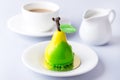 Beautiful Small Mousse Cake in Shape of Pear Tasty Modern Dessert Pastry White Blue Background Cup of Coffee