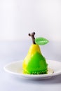 Beautiful Small Mousse Cake in Shape of Pear Tasty Modern Dessert Pastry White Blue Background Vertical