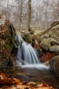 Beautiful small veil cascading waterfall, mossy rocks Royalty Free Stock Photo