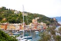 Beautiful small village Portofino with colorfull houses, luxury boats and yachts in little bay harbor. Liguria, Italy Royalty Free Stock Photo