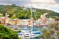 Beautiful small village Portofino with colorfull houses, luxury boats and yachts in little bay harbor. Liguria, Italy Royalty Free Stock Photo