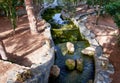 Beautiful small waterfall with cascades in Reina Sofia Park, Guardamar del Segura. Valencia, Spain. Royalty Free Stock Photo