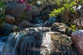 Beautiful small waterfall in a japanese style garden Royalty Free Stock Photo