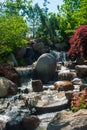 Beautiful small waterfall in a japanese style garden Royalty Free Stock Photo