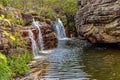 Beautiful and small waterfall among the rocks and vegetation of the Biribiri environmental reserve Royalty Free Stock Photo