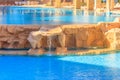 Beautiful small waterfall in swimming pool Royalty Free Stock Photo