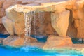 Beautiful small waterfall in swimming pool Royalty Free Stock Photo