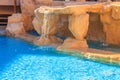 Beautiful small waterfall in swimming pool Royalty Free Stock Photo