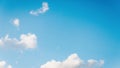 Beautiful small white fluffy clouds on a blue sky background. Copy space, 16:9 panoramic format Royalty Free Stock Photo