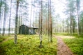 A beautiful small wooden building in the middle of Finnish forest Royalty Free Stock Photo